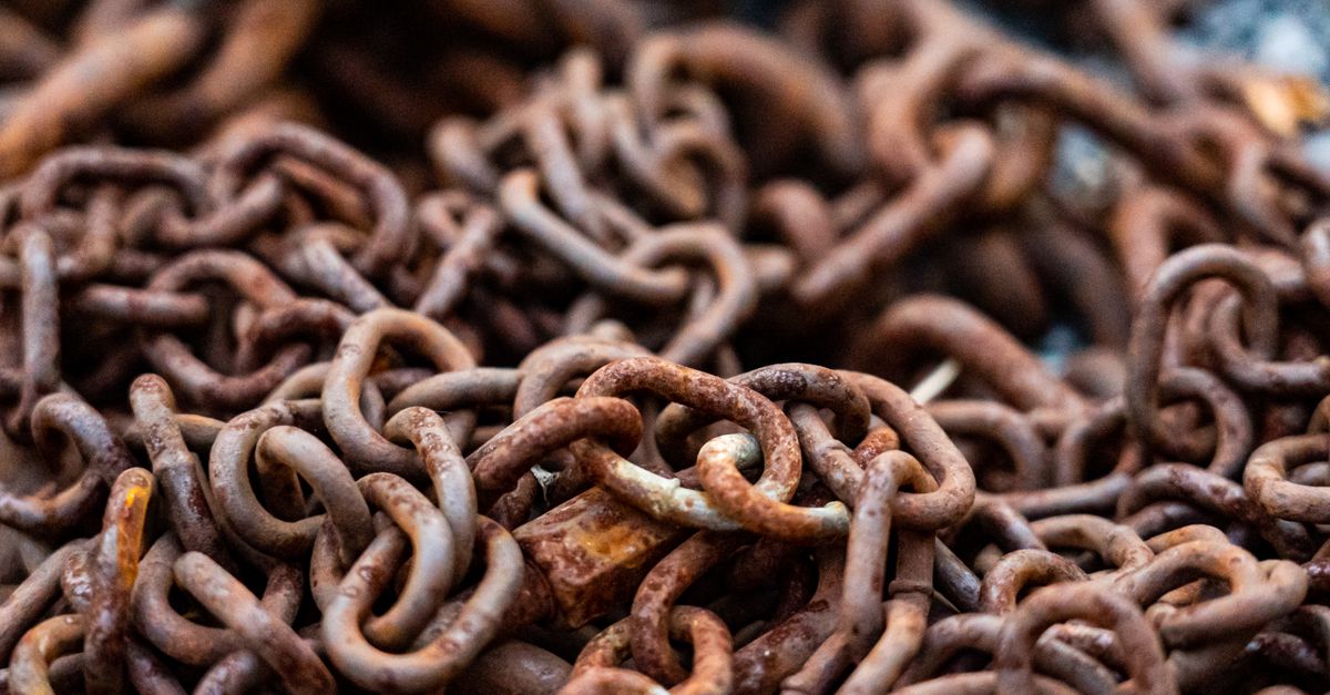 A detailed close-up of rusty chains showcasing texture and decay.
